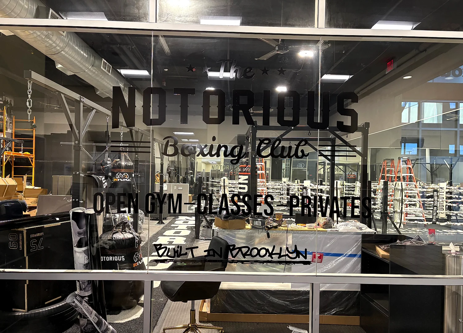 Black vinyl window lettering reading Notorious Boxing Club, Open Gym Classes Privates, Built in Brooklyn