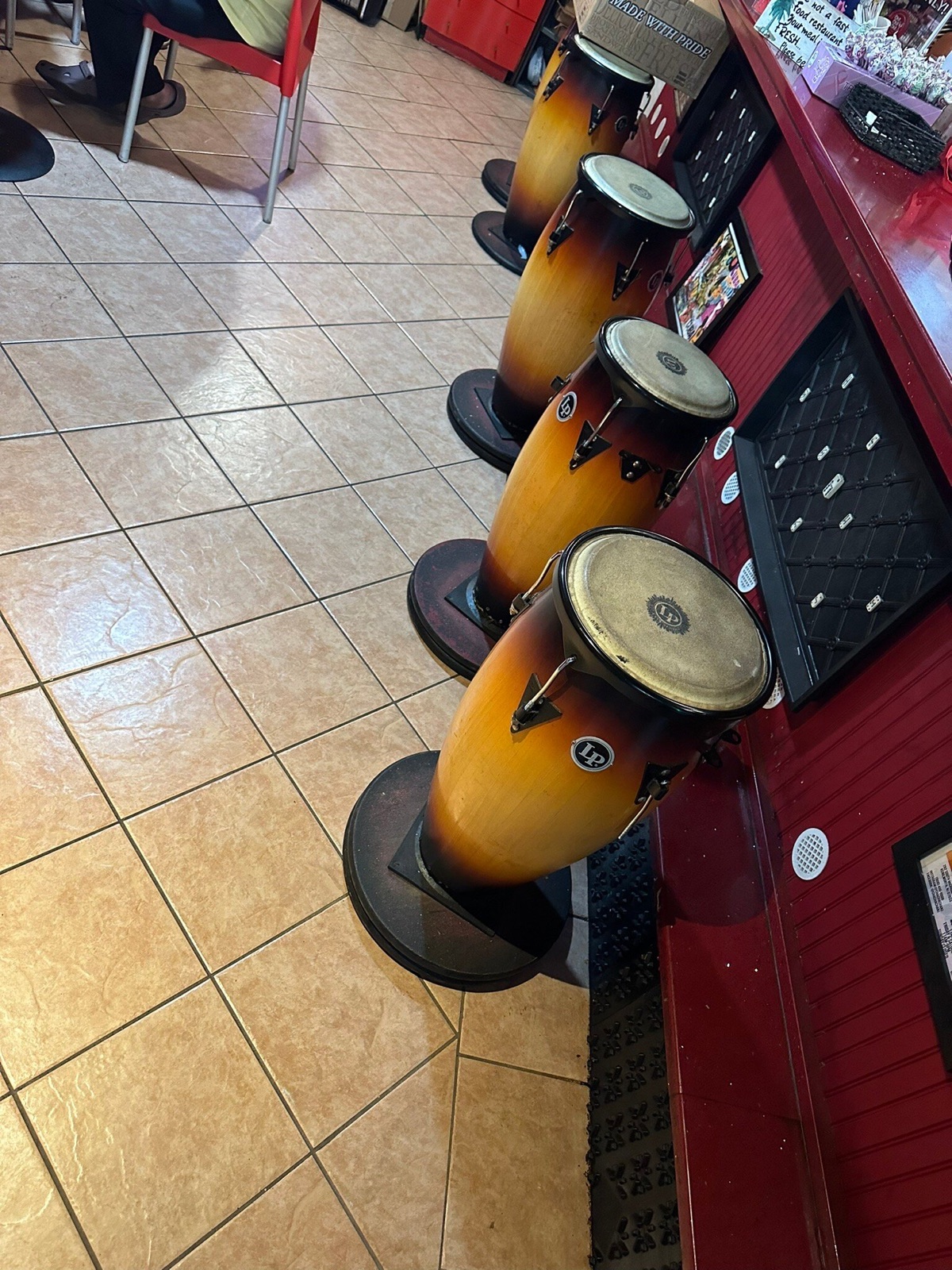 Cha Cha Cha Cuban Cafe interior with drum stools at the counter